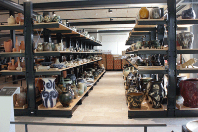Ceramics displayed on Cantilever shelves at Holmegaard